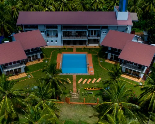 Aerial view of Tara Watergate hotel and pool beside the Tissa lake
